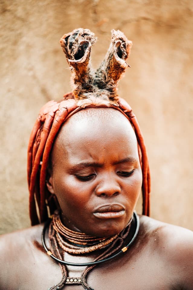 Close-up of a Himba woman's ornate hair styling in Namibia