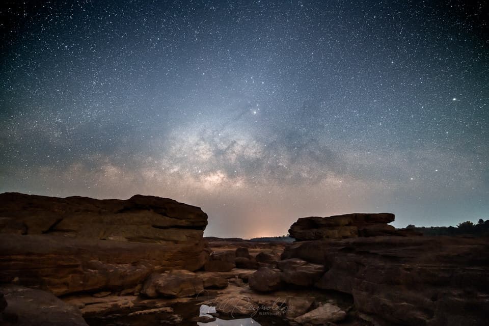 Milky Way galaxy over rocky landscape at Sam Phan Bok in Ubon Ratchathani, Thailand