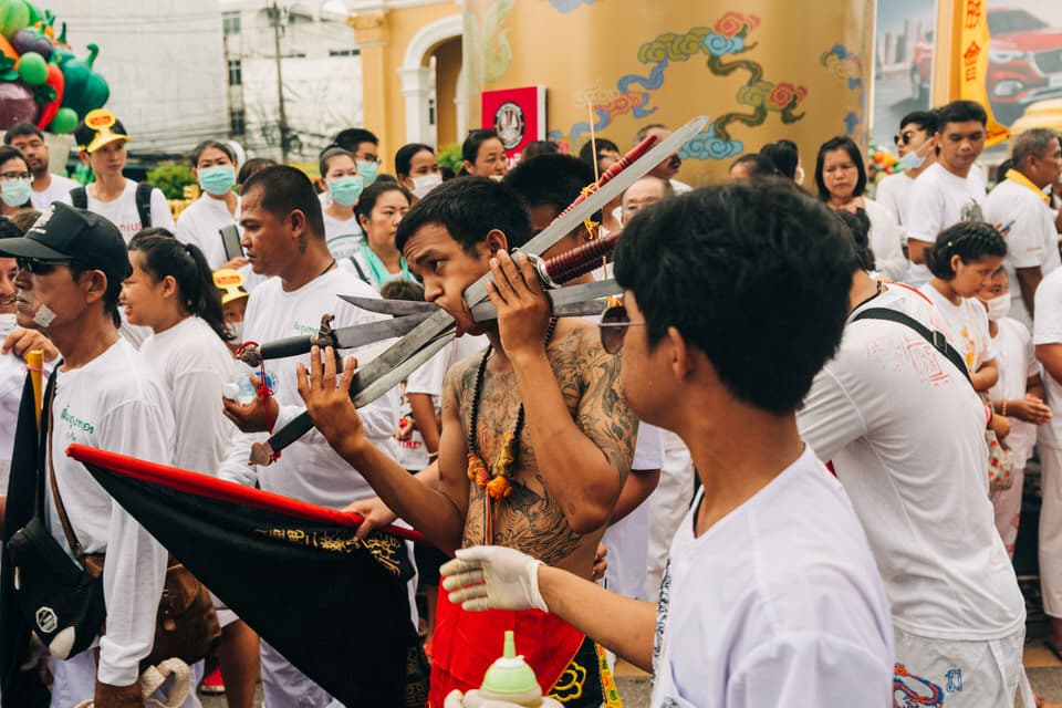 Devotees in white during the Phuket Vegetarian Festival in Old Town Phuket.