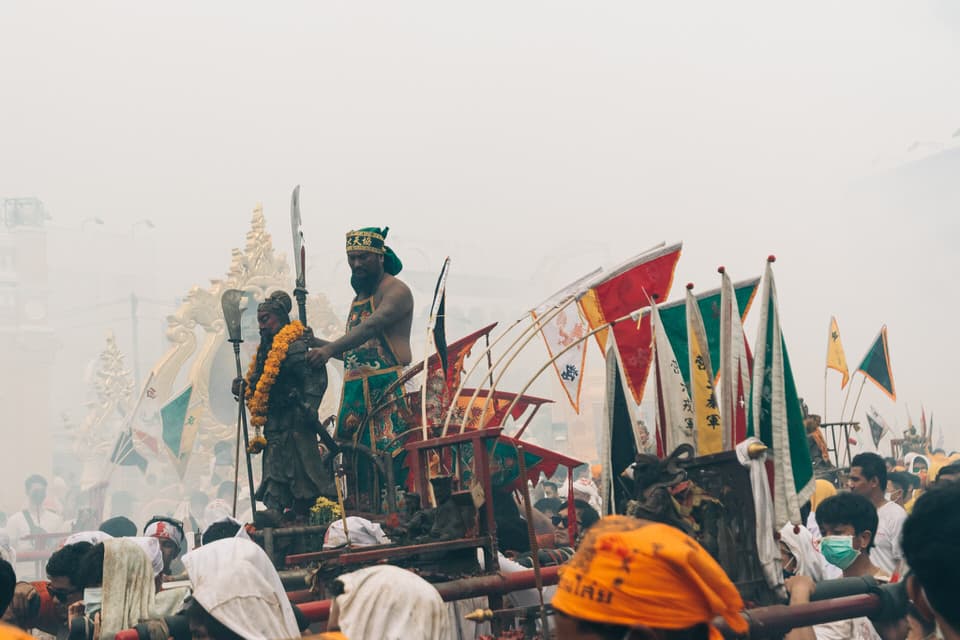 Devotees in ceremonial attire during the Phuket Vegetarian Festival.