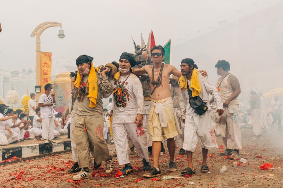 Procession with spiritual elements during Phuket Vegetarian Festival.